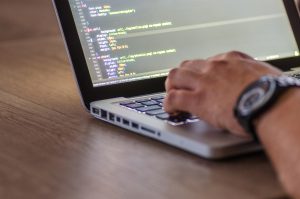 Man working on laptop in office